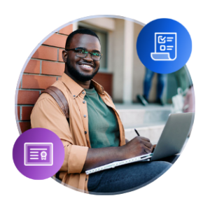 A male international student sits on concrete steps of a campus building with a silver laptop on his lap. He is wearing casual clothes and a brown backpack.