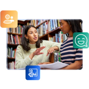 Two students sit in a library talking