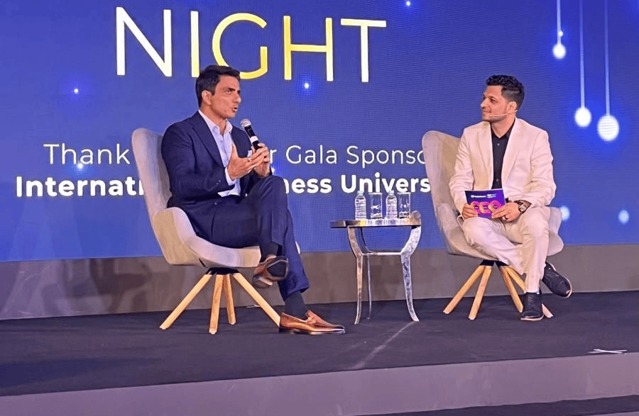 Actor and philanthropist Sonu Sood sits on stage at TRW with ApplyBoard CEO Meti Basiri.