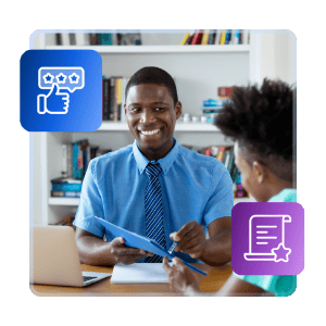 A student advisor sits across from a student at a desk in their office, smiling and pointing to something on a piece of paper